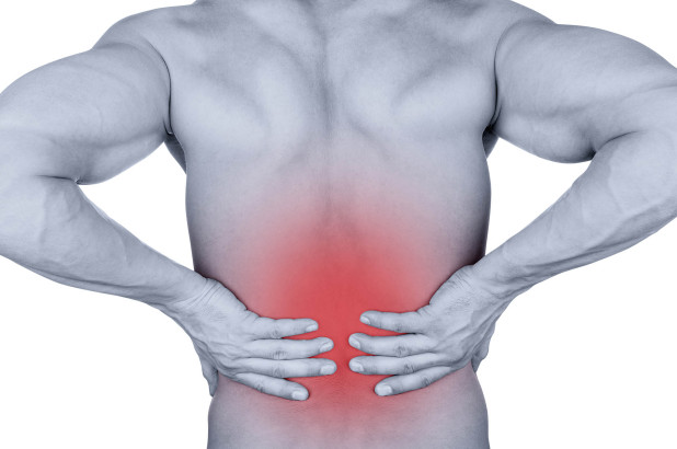 Man with chronic back pain or spinal pain waiting to see specialist
